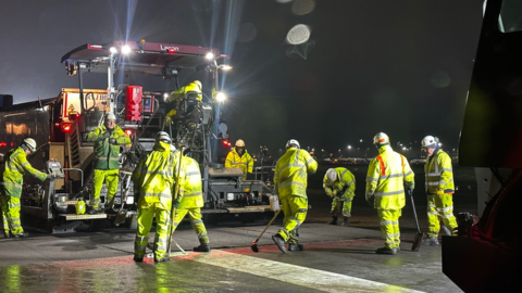 Engineers at Stansted Airport relaying asphalt