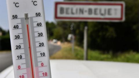 A thermometer in the south-western French village of Belin-Beuet during the heatwave on 23 July 2019