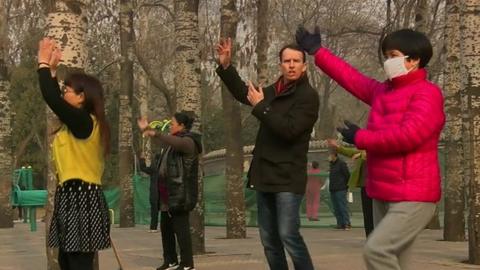 John Sudworth dancing with two Chinese women