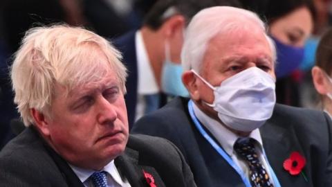 Boris Johnson sat without a mask next to Sir David Attenborough at COP 26