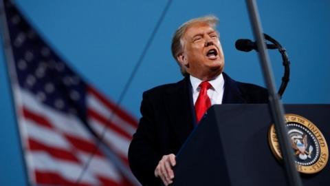 President Donald Trump speaks during a campaign event in Fayetteville, Arkansas