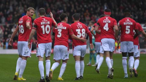 Wrexham players celebrate a goal