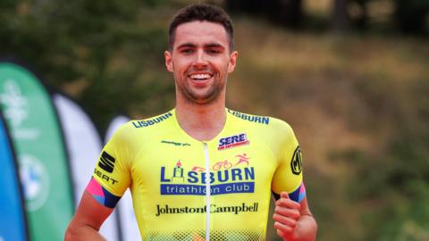 James Edgar shows his delight as he crosses the line in the Phoenix Park to win the Dublin City Triathlon