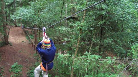 Woman on a zip wire
