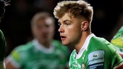 Charlie Atkinson runs with the ball while playing for Leicester Tigers