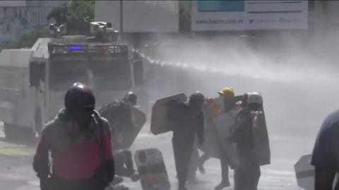 Water cannon is used on protesters in Caracas (18 May)