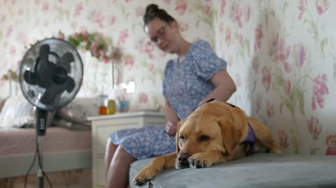 Lauren Matthewson with her support dog Fliss
