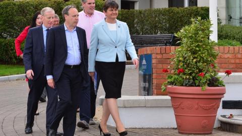 DUP members Emma Little-Pengelly, Sammy Wilson, Gregory Campbell, Gavin Robinson, Nigel Dodds and party leader Arlene Foster outside the Stormont hotel in Belfast.