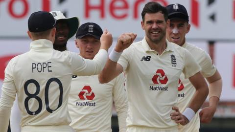 James Anderson celebrates with England team-mates