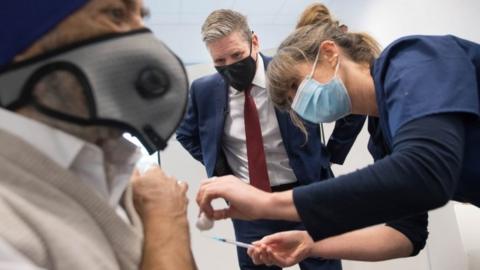 Sir Keir Starmer watches covid vaccination