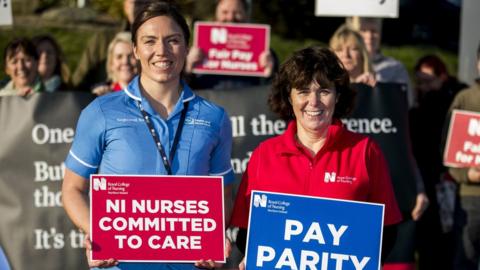 Nurses on strike holding placards outside the Ulster Hospital