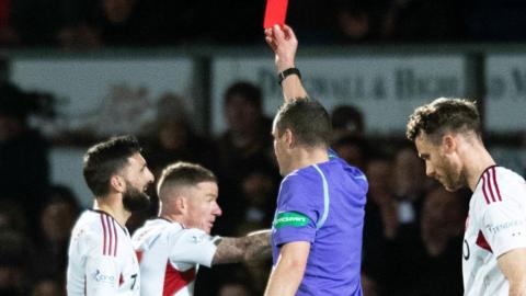 Aberdeen's Graeme Shinnie is shown a red card