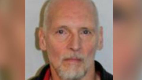 Torben Stig Hersborg, a balding man with white hair and white beard