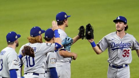 LA Dodgers players celebrate after winning game three of the World Series