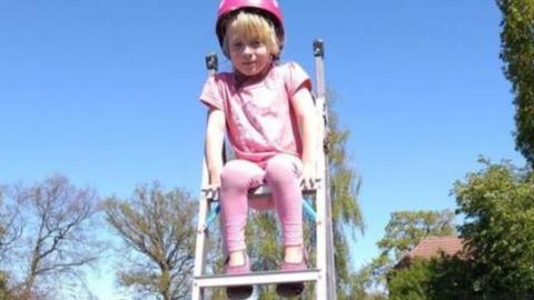 Esther Windass lives in a bungalow so is climbing stepladders in the garden