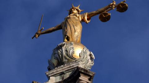 Statue of Justice above the Central Criminal Court building, Old Bailey in London.
