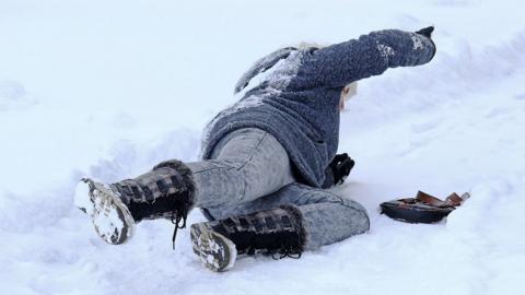 Woman falling on ice