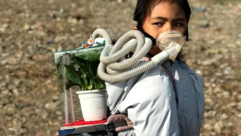 Licypriya wears her symbolic Sukifu (Survival Kit for the Future) to promote the need to curb air pollution