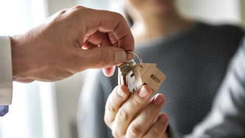 Stock image of keys exchanged