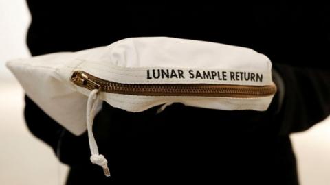 The bag used to collect samples of the Moon is displayed at Sotheby's