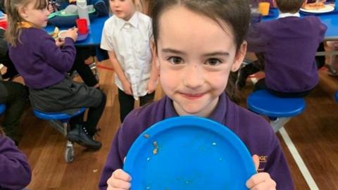 Child with empty plate