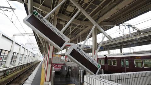 Train platform with part of the structure collapsed