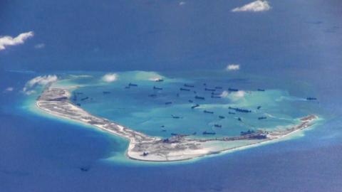 Chinese dredging vessels in the waters around Mischief Reef