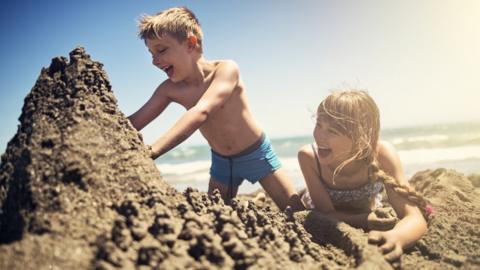 Brother and sister on beach