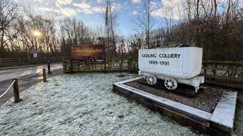 The main entrance to Gedling Country Park with a sign saying Gedling Colliery 1899-1991