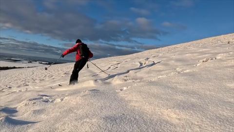 Skier on snowy mountain
