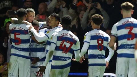 QPR claim three points and leapfrog Reading to claim third place with late penalty.