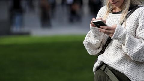 A woman uses her mobile phone in Spain