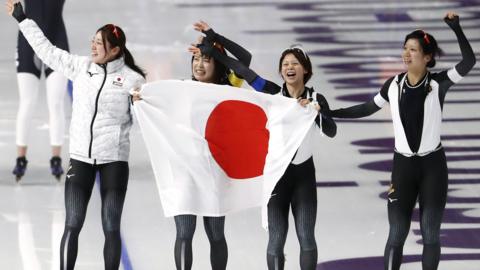 Japan's women's speed skating team celebrate