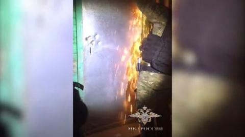 Russian special forces cut down a door to rescue a kidnapped boy