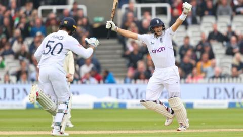 Ben Foakes (left) and Joe Root (right) celebrate victory