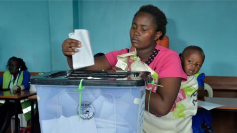 A woman casts her ballot in Kenya's election re-run