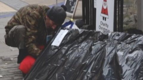 Christopher Sanderman who is newly homeless in Bristol getting into a sleep pod