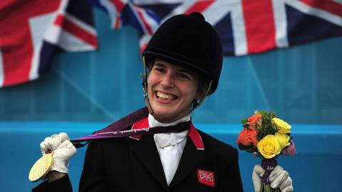 Sophie Christiansen posing with her gold medal