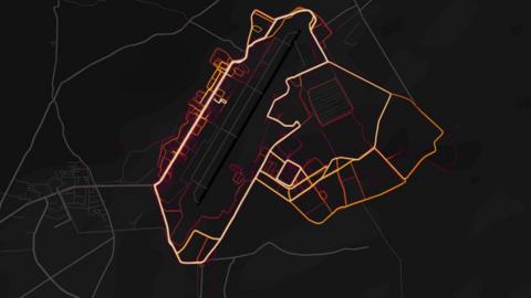 Red "heat lines" are arrayed neatly in the pattern of roads and streets on a dark black map