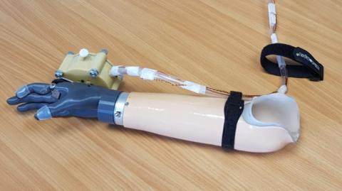 Breath powered prosthetic hand