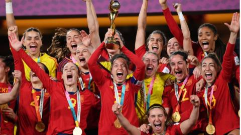 Ivana Andres of Spain lifts the FIFA Women's World Cup Trophy