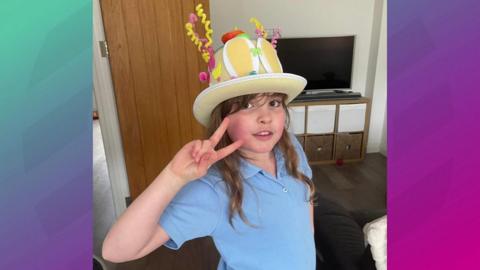 Girl in Easter bonnet.