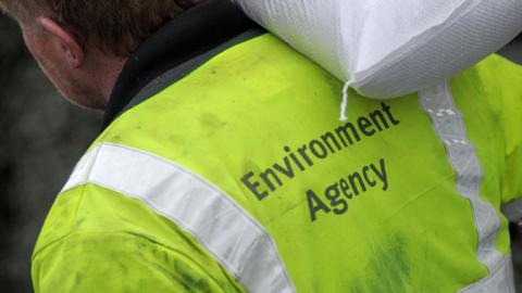 Environment Agency worker in high visibility jacket.