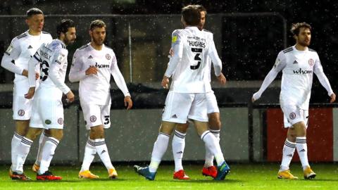 Accrington were ahead at Sincil Bank inside five minutes after a goal from Dion Charles, who struck again in the 90th