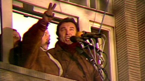 Karel Gott and Karel Kryl sing the national anthem to thousands of protesters in Prague during the Velvet Revolution in 1989.