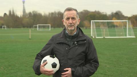 Chris Morris holding football