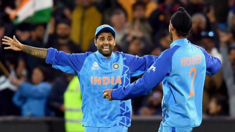 Suryakumar Yadav and Arshdeep Singh of India celebrate a wicket during the ICC Men's T20 World Cup match between India and Bangladesh