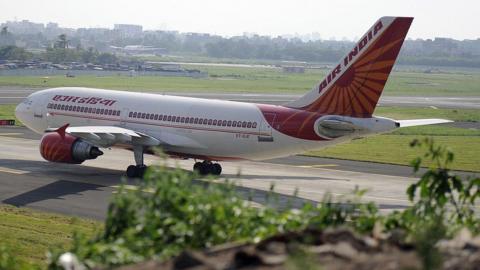 An Indian Airlines plane taxes towards takeoff at Mumbai airport on September 27, 2009.