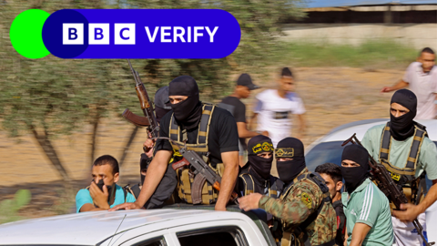 Hamas militants on the back of a vehicle