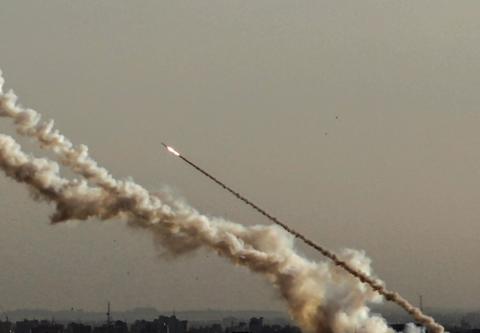 A rocket fired from Gaza flies towards Israel